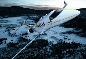 A Bombardier Learjet 70 light jet in flight.